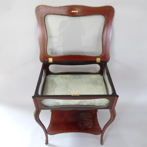 2064 - A Victorian mahogany rectangular vitrine table, with inlaid decoration, glazed panels and under tier... 