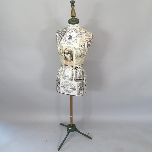 2071 - A shop display mannequin on stand, with applied decoupage decoration, 158cm