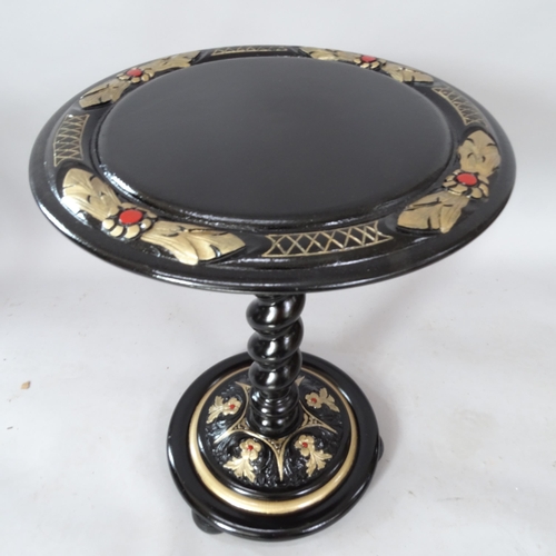 2073 - A circular-topped black lacquered occasional table, on spiral turned column with carved decoration, ... 