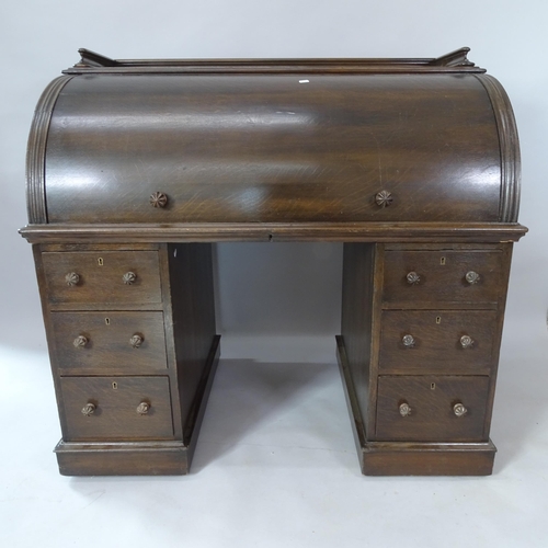 2076 - A 19th century oak cylinder-front twin-pedestal writing desk, with fitted and sliding interior, 120c... 