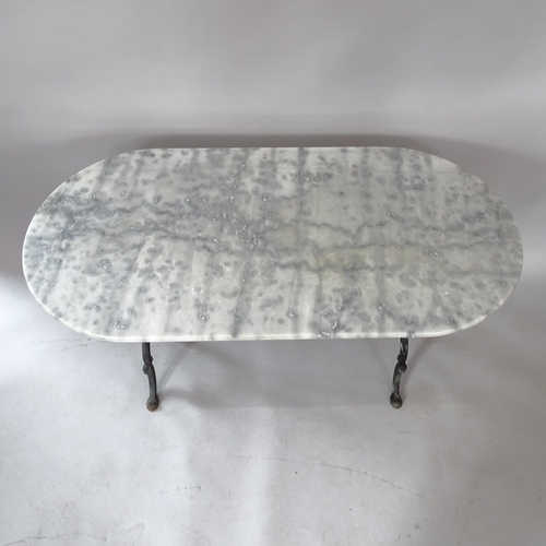 2077 - An oval marble-top garden table on cast-iron frame, 120cm x 73cm x 61cm