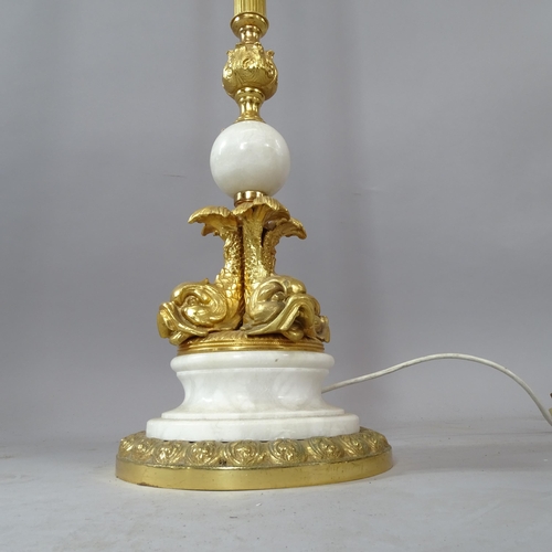 2084 - A French Empire style brass standard lamp and shade, with dolphin decoration to base, height overall... 