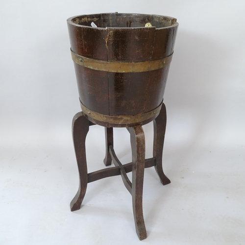 2086 - Lister, metal-bound oak jardiniere on stand, diameter 31cm, height 70cm