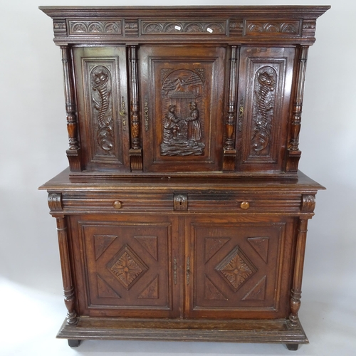 2090 - A 19th century Continental oak 2-section dresser, with 5 carved and panelled doors, and 2 frieze dra... 