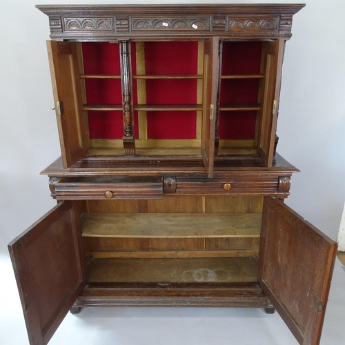 2090 - A 19th century Continental oak 2-section dresser, with 5 carved and panelled doors, and 2 frieze dra... 