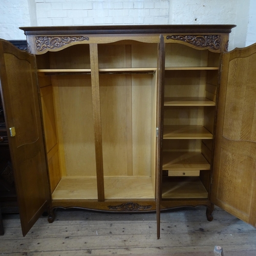 2091 - A French oak triple wardrobe, 178cm x 186cm x 60cm