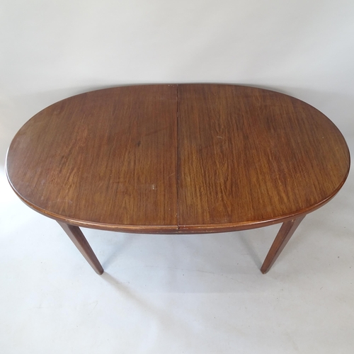 2099 - A mid-century oak oval extending dining table, L152cm extending to 199cm, H74cm, D92cm