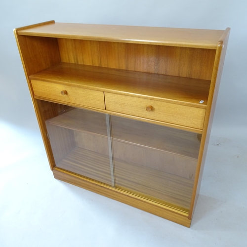 2106 - A contemporary light oak bookcase, by Nathan Furniture, with 2 fitted drawers and glass sliding door... 