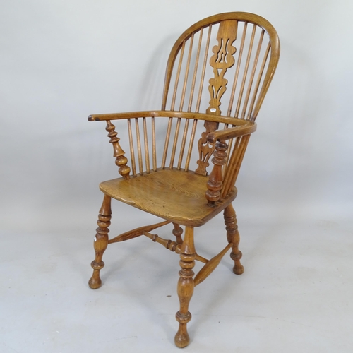 2109 - An Antique oak and elm-seated Windsor bow-arm kitchen chair