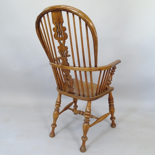 2109 - An Antique oak and elm-seated Windsor bow-arm kitchen chair