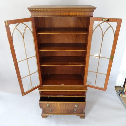 2116 - A reproduction mahogany single-section bookcase on chest, with 2 lattice-glazed doors, 3 adjustable ... 