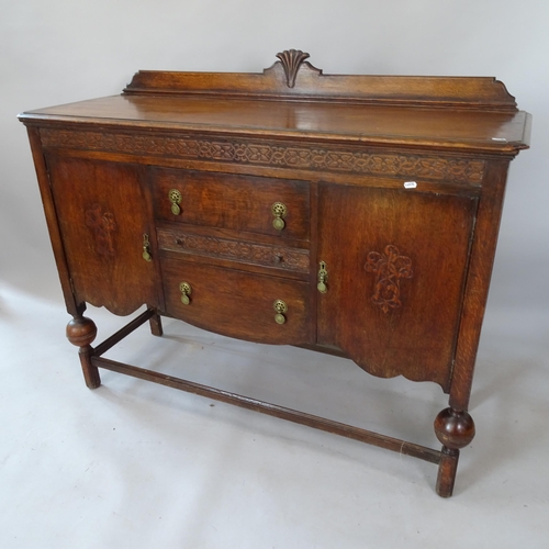 2126 - A 1930s oak sideboard, 138cm x 107cm x 47cm