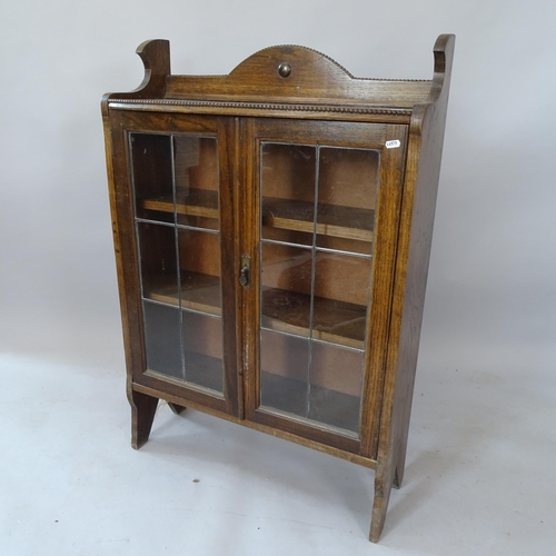 2127 - An Antique oak bookcase, with 2 leadlight-glazed doors, and 3 fixed shelves, 73cm x 108cm x 26cm