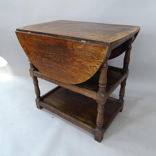 2128 - An Antique oak drop leaf table on 2-tiered shelved base, 78cm x 75cm x 50cm extending to 112cm