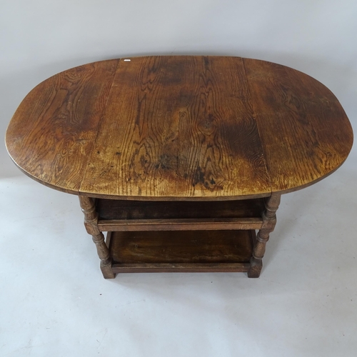 2128 - An Antique oak drop leaf table on 2-tiered shelved base, 78cm x 75cm x 50cm extending to 112cm