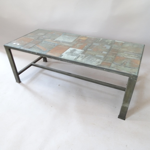 2167 - A contemporary rectangular coffee table, with inset glass top, on metal frame, with inset printing b... 