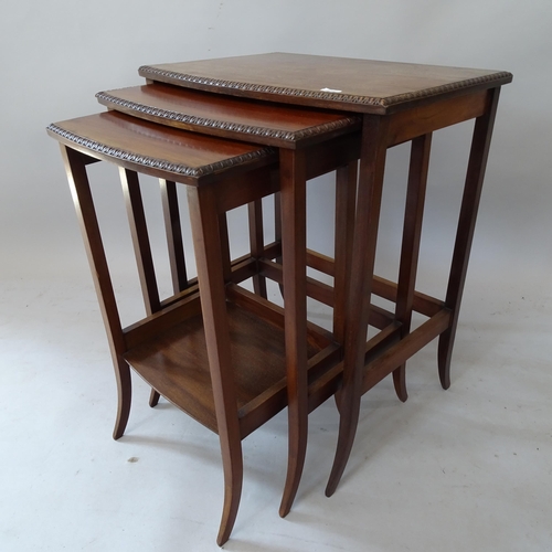 2175 - A reproduction mahogany nest of 3 occasional tables, largest 47cm x 61cm x 35cm