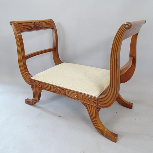 2184 - A reproduction yew wood Continental style window seat, with carved decoration, 87cm x 76cm x 47cm