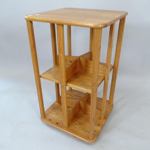 2192 - A mid-century elm sentry design revolving bookcase, W46cm, H75cm