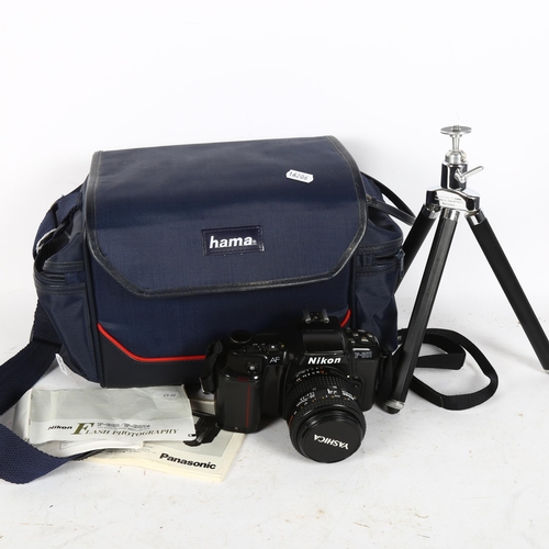 293 - Nikon F-601 35mm film camera, with Nikkor 35-70mm lens and accessories, in softshell case