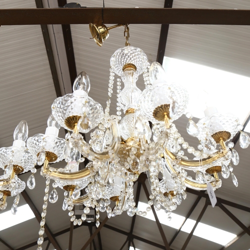 308 - A pair of 8-branch brass and glass chandeliers, with glass drops, height 80cm