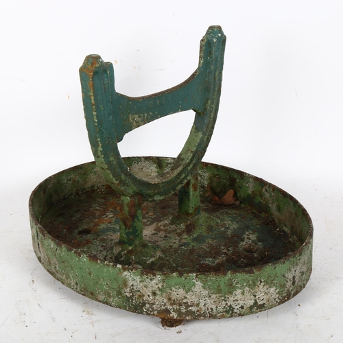 309 - A green painted cast-iron boot scraper, length 33cm, height 25cm