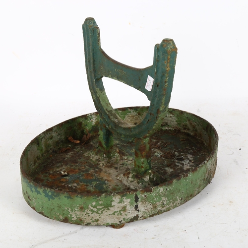 309 - A green painted cast-iron boot scraper, length 33cm, height 25cm