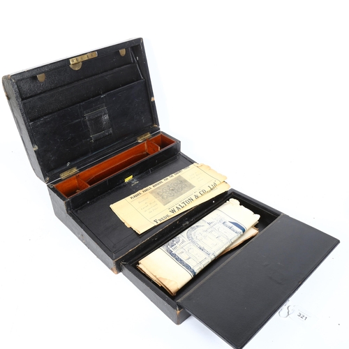 321 - A 19th century black leather travelling folding writing slope, width 31cm