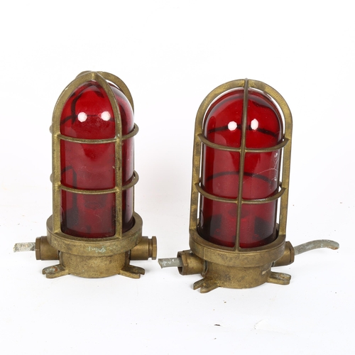 324 - A pair of brass-mounted red glass ship's bulkhead lamps, length 22cm