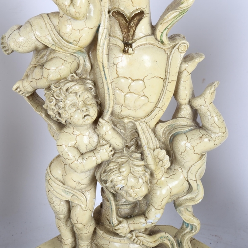 330 - A set of 3 Classical style painted resin cherub candlesticks, largest height 38cm