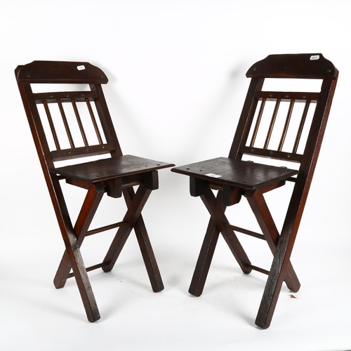 368 - A pair of child's stained oak folding chairs, height 65cm