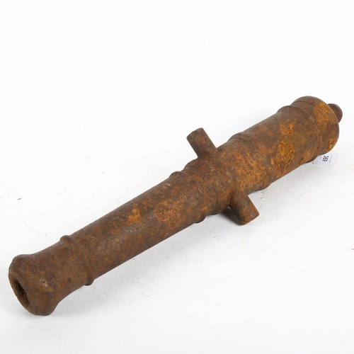 369 - A small scale cast-iron garden cannon, length 54cm