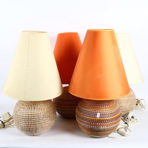 375 - A set of 4 African basket table lamps and shades, overall height 53cm