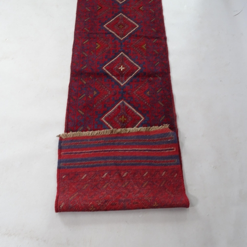 2358 - A red ground Meshwani runner, 253cm x 64cm