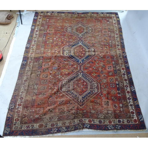 2364 - A red ground Qashqai carpet, 270cm x 192cm