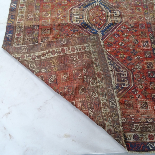 2364 - A red ground Qashqai carpet, 270cm x 192cm