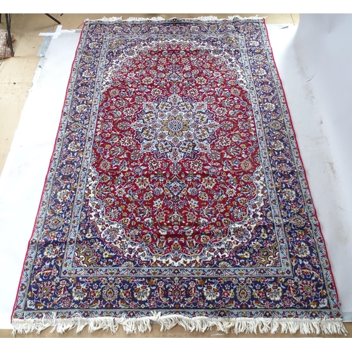 2368 - A modern machine-made red and blue ground Kashmiri carpet, 290cm x 186cm