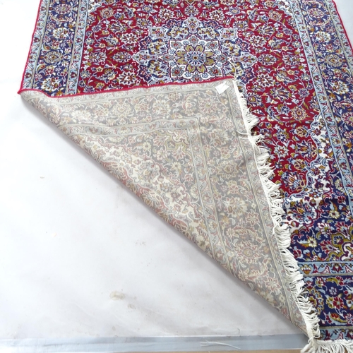 2368 - A modern machine-made red and blue ground Kashmiri carpet, 290cm x 186cm