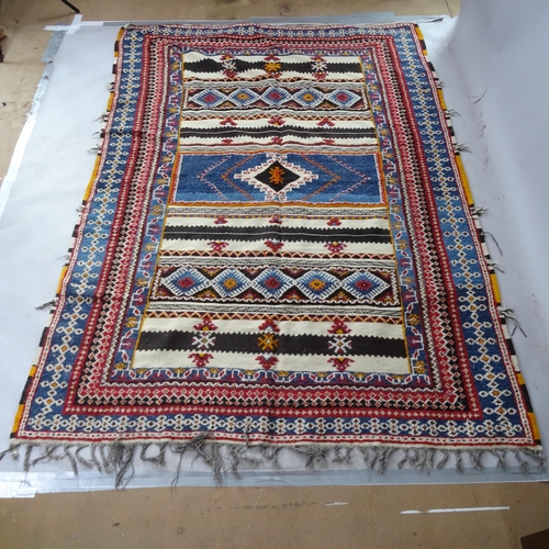 2376 - A Berber blue ground carpet, with symmetrical border, 255cm x 185cm