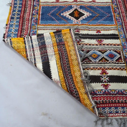 2376 - A Berber blue ground carpet, with symmetrical border, 255cm x 185cm