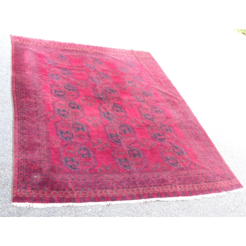 2378 - A red ground Afghan carpet, 331cm x 260cm