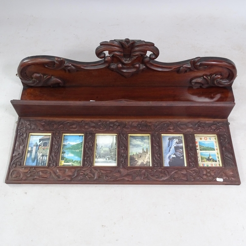 2380 - An Antique carved mahogany picture frame, 93cm x 42cm x 13cm, and a mahogany hanging shelf, with car... 