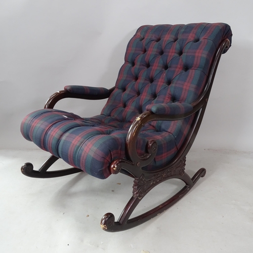 2391 - A reproduction mahogany rocking chair, with button-back tartan upholstery