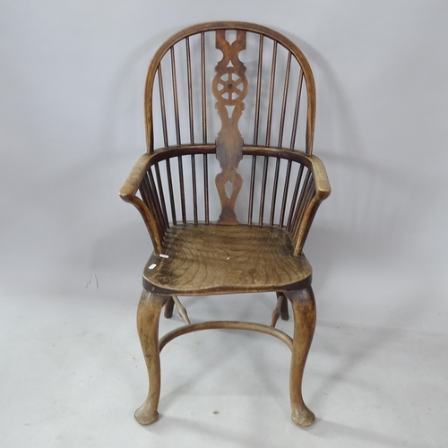 2250 - An oak and elm-seated wheel-back kitchen chair, with crinoline stretcher