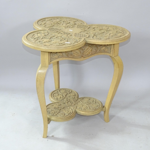 2252 - A modern light oak 2-tier clover design occasional table, with chip carved decoration, 60cm x 60cm