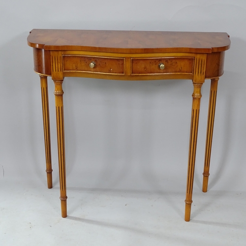 2256 - A reproduction yew wood console table of serpentine form, with 2 frieze drawers and fluted legs, W80... 