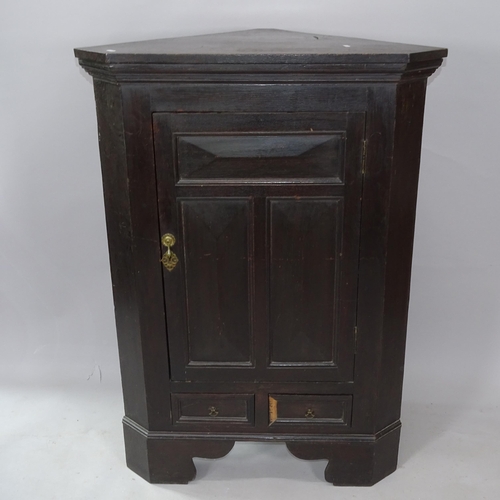 2258 - A Georgian oak corner cupboard, with single panelled door and drawers below, 85cm x 120cm x 48cm