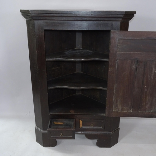 2258 - A Georgian oak corner cupboard, with single panelled door and drawers below, 85cm x 120cm x 48cm