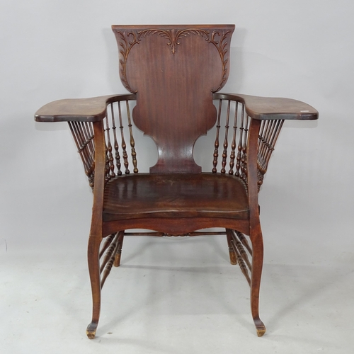 2259 - An Antique Arts and Crafts oak and elm-seated armchair in the manner of Libertys