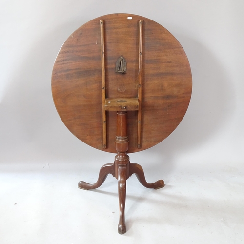 2261 - A Georgian mahogany circular-top tilt-top table, on tripod base, 89cm x 73cm